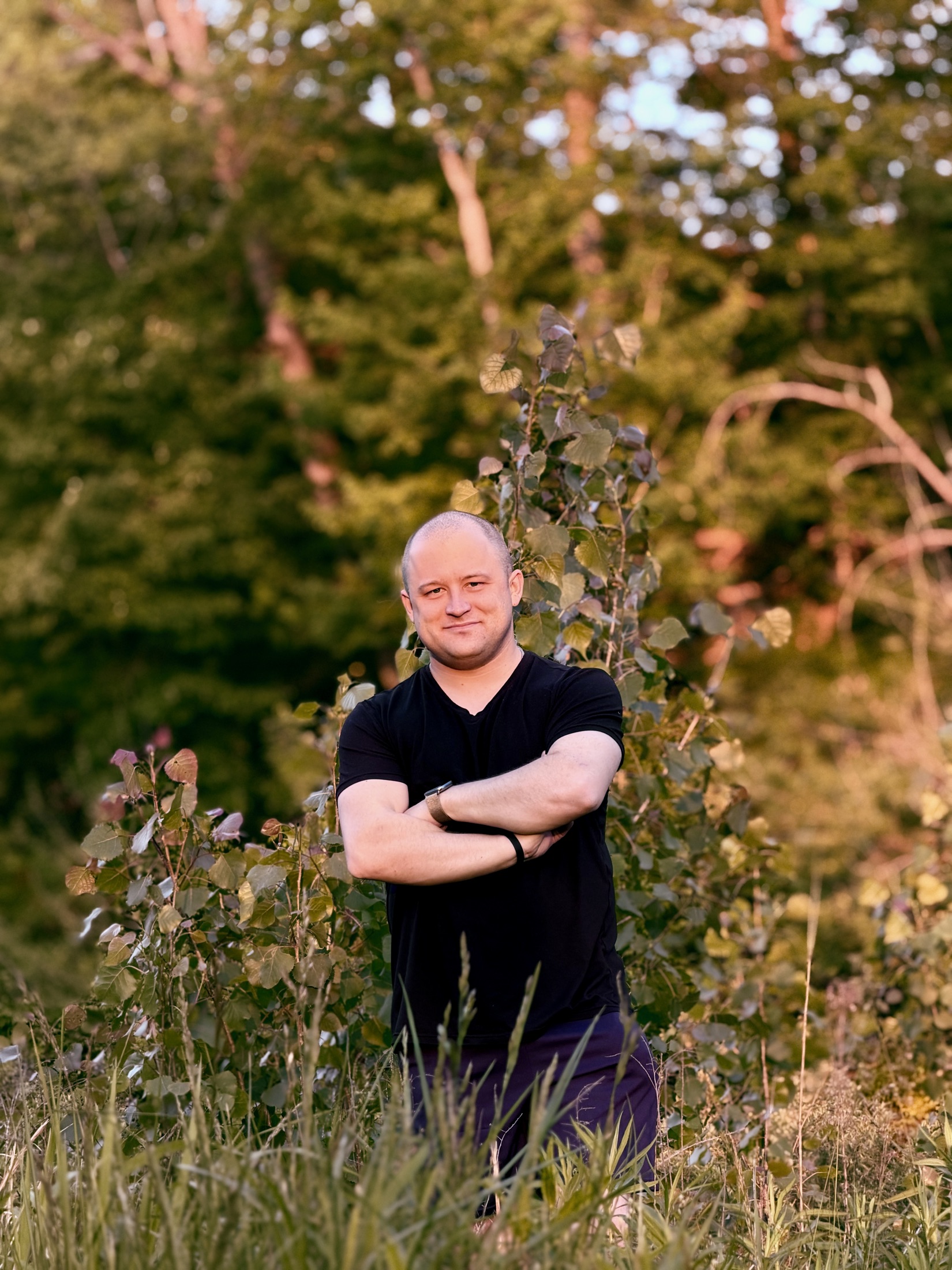 Grant Morgan standing in the woods